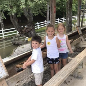 three kids smile while flume mining at Gem Mountain